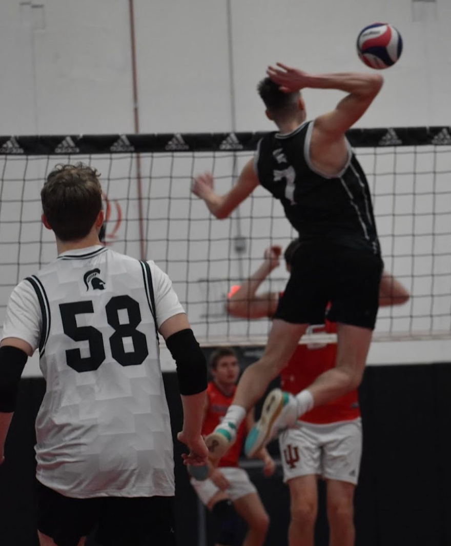 Christian Roberts— Alumnus Christian Roberts spikes the ball.