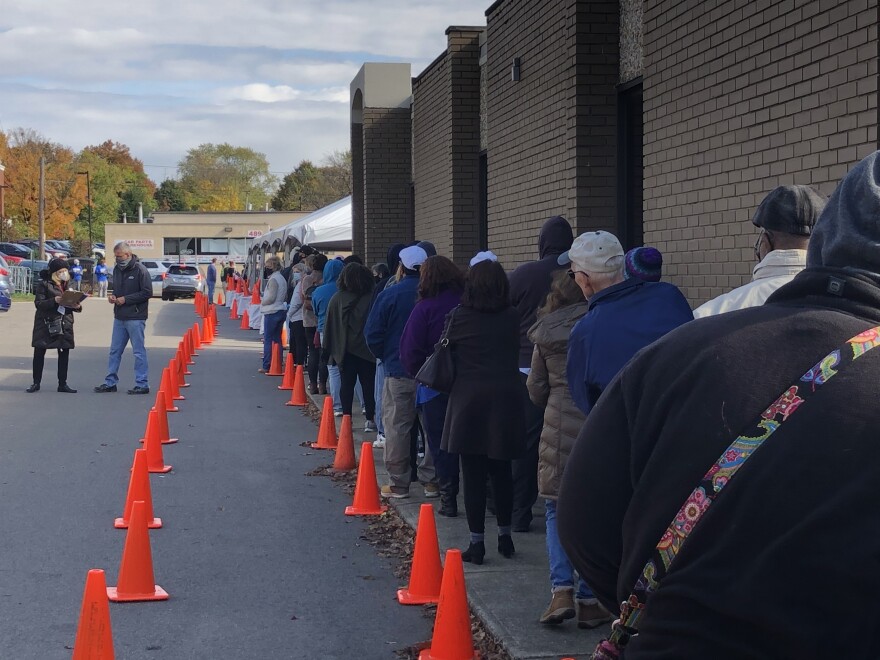 Pictured are voters waiting in line at the Summit County Board of Elections. Early voting in Northeast Ohio continued to draw long lines at county boards of elections over the weekend. 