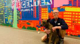 Rick Kann and his dog Otis at the LGBT Center in Orlando. (via Talia Blake/WMFE)
