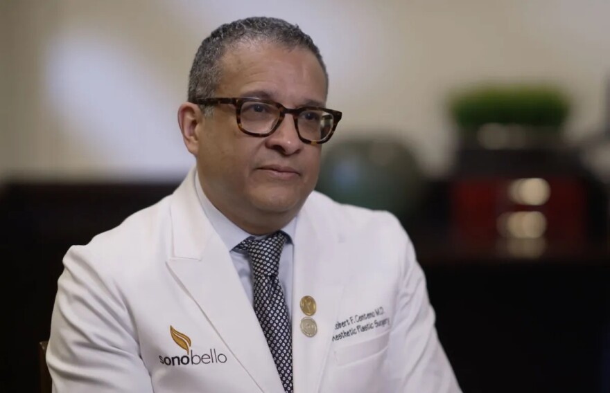 Surgeon in a white coat with the logo for sono bello on the right pocket