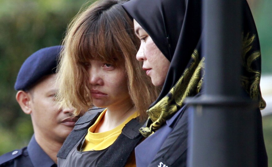 Vietnamese suspect Doan Thi Huong (center) is escorted by police officers at the court in Sepang, Malaysia, on Wednesday.