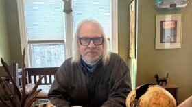 Woodturning artist Mark Taylor surrounded by some of his pieces