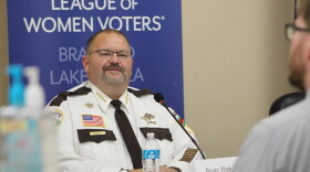 Sheriff Bryan Welk participates in a sheriff's candidate forum Sept. 8, 2026, at Sylvan Town Hall in southern Cass County. In the foreground is Cass County Attorney Ben Lindstrom.