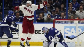 Carolina Hurricanes center Jordan Staal (11) celebrates after right wing Sebastian Aho scored past Tampa Bay Lightning goaltender Andrei Vasilevskiy (88) during overtime in Game 3 of an NHL hockey Stanley Cup second-round playoff series Thursday, June 3, 2021, in Tampa, Fla. (AP Photo/Chris O'Meara)