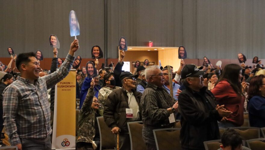 AFN attendees wave their Mary Peltola fans at the U.S. House candidate forum. (Elyssa Loughlin/Alaska Public Media).