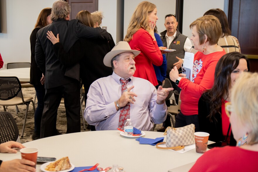 Rep. Mark McBride (R-Moore) speaks with public school advocates at an OKPLAC event during National Public Schools Week.