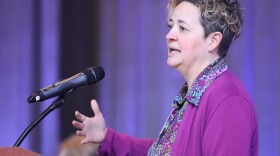 Woman at a microphone