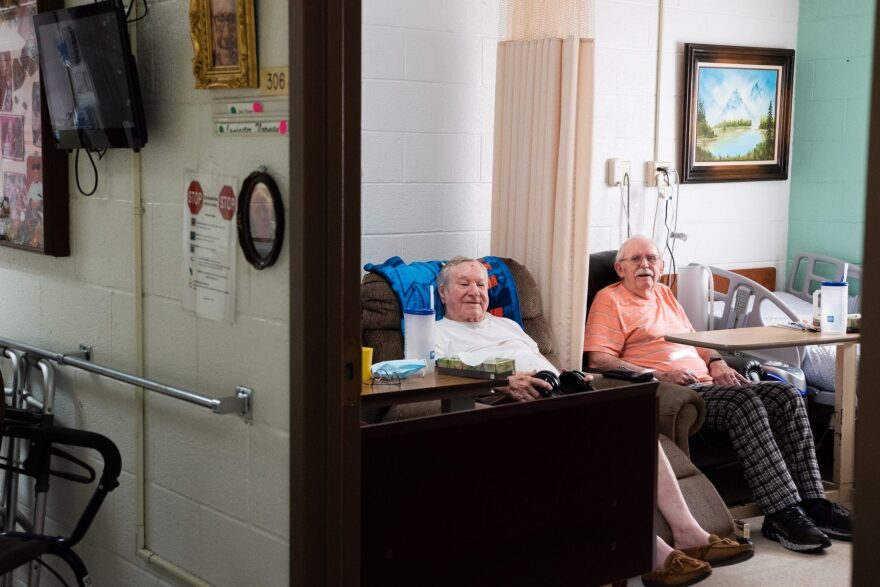 In this file photo are Earl Prigmore, left, and Norm Lancaster, residents of Beadles Nursing Home in Alva. When interviewed last last year, both said they would rather take their chances with COVID-19 than be confined to their rooms any longer.