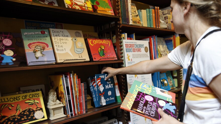 Anne Sophie Parigot searches for books for her 3- and 6-year-old children at the New York Public Library bookstore in 2013.