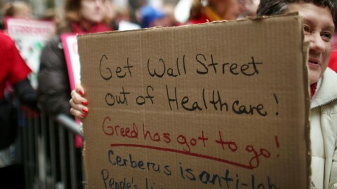 Dozens of nurses and activists protest the practices of the equity firm's health unit, Steward Health Care Systems, outside offices of Cerberus Capital on December 20, 2011 in New York City.