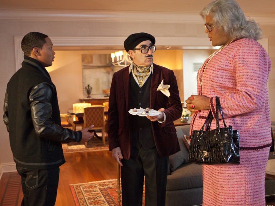 In Madea's Witness Protection, George Needleman (Eugene Levy, center) is put in witness protection with Madea (Tyler Perry, right) after he discovers he's the fall man for a Ponzi scheme.