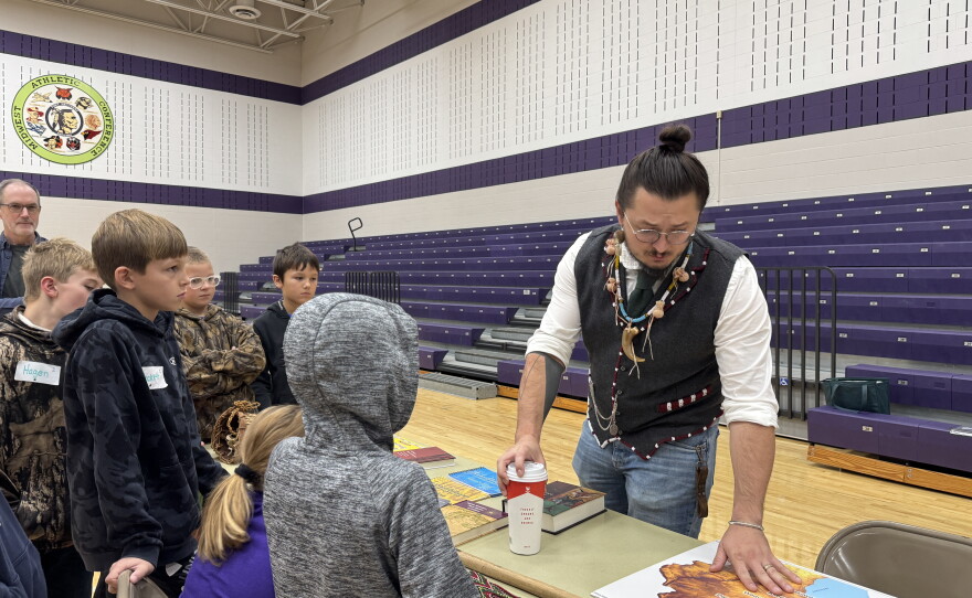Tribal Historic Preservation Officer for the Miami Tribe Logan York shows students maps of traditional Myaamia homelands.