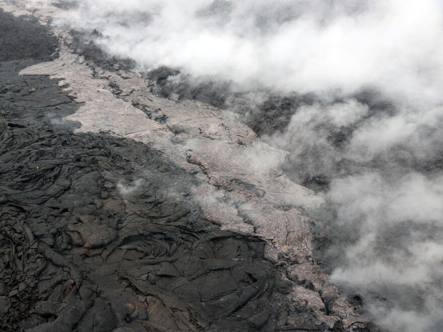 Telephoto view of a small lava flow (lighter in color) and spatter (blue-gray) that were erupted from a section of the crack on the west flank of Pu'u O'o on May 1.