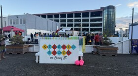 Fairbanksans chat and dance Oct. 10, 2025, at the former site of the Polaris Building and future site of a temporary ice rink.