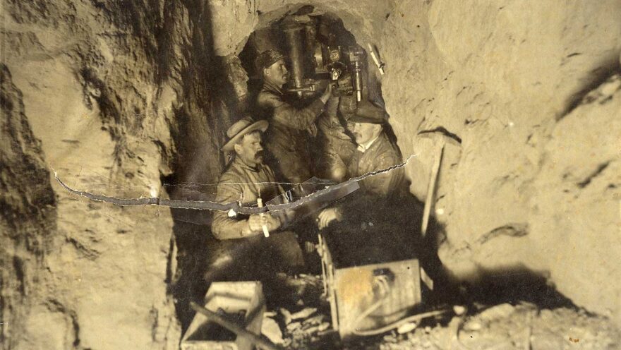 An archival, sepia-toned photo shows three old-timey miners in the Chicago Carr Mine shaft. Inside the Chicago Carr Mine in Colorado.