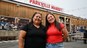 Fanny Puertas (L) owner of Mercado 27 in Parkville Market and her daughter Africa Vargas (R) stand outside in the courtyard of Parkville market in Hartford, Connecticut on July 15, 2026.