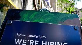 A poster board for a Starbucks in Indianapolis advertising a job opening.