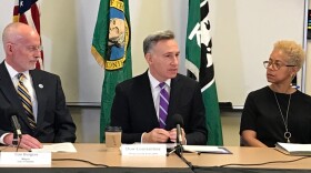 Former Seattle Mayor Tim Burgess, King County Executive Dow Constantine and Deputy Executive Rhonda Berry at a press conference announcing the intent to move youth detention oversight to Public Health Seattle King County.