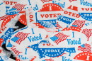Concept for the end of the election in the USA with torn and scratched campaign buttons on glass