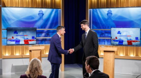 U.S. Rep. Tom Barrett, R-Charlotte, left, and Democratic nominee for U.S. House William Lawrence, right, shake hands at their first head-to-head debate at WKAR's studios in East Lansing, Mich., on Oct. 6, 2026.