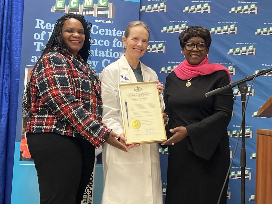 At center, Dr. Liise Kayler, director of ECMC's Kidney Transplant Center, holds a framed pen and certificate marking the signing of the New York HEART Act into law. With her are, left to right, State Senator April Baskin and Assembly Majority Leader Crystal Peoples-Stokes, who worked to get the legislation passed.