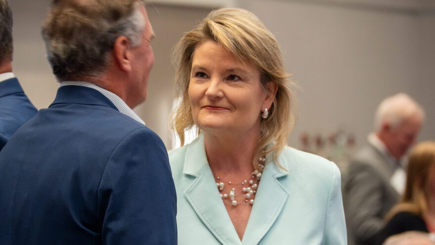 Cindy Holscher, the Democratic nominee for Kansas governor, points to differences on healthcare, public schools and other issues illustrate the distinctions between her and Republican nominee Ty Masterson. This image from Aug. 27,2026, is of Holscher campaigning in Olathe.