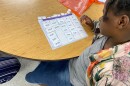 A Huntersville Elementary student works on a reading lesson.