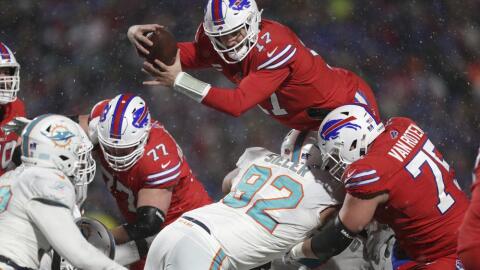 Buffalo Bills quarterback Josh Allen (17) dives for a two-point conversion during the second half of an NFL football game against the Miami Dolphins in Orchard Park Dec. 17, 2022.