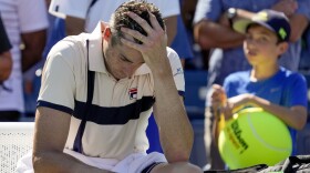 John Isner, of the United States, reacts after losing to Michael Mmoh, of the United States, during the second round of the U.S. Open tennis championships, Thursday, Aug. 31, 2023, in New York. (AP Photo/John Minchillo)