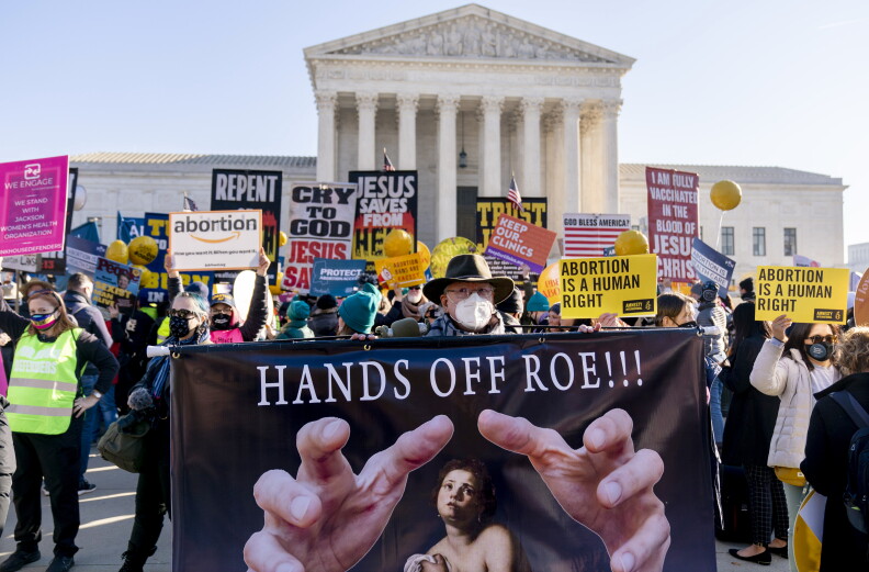 Abortion rights advocates and anti-abortion protesters demonstrate in front of the U.S. Supreme Court on Dec. 1, 2021.