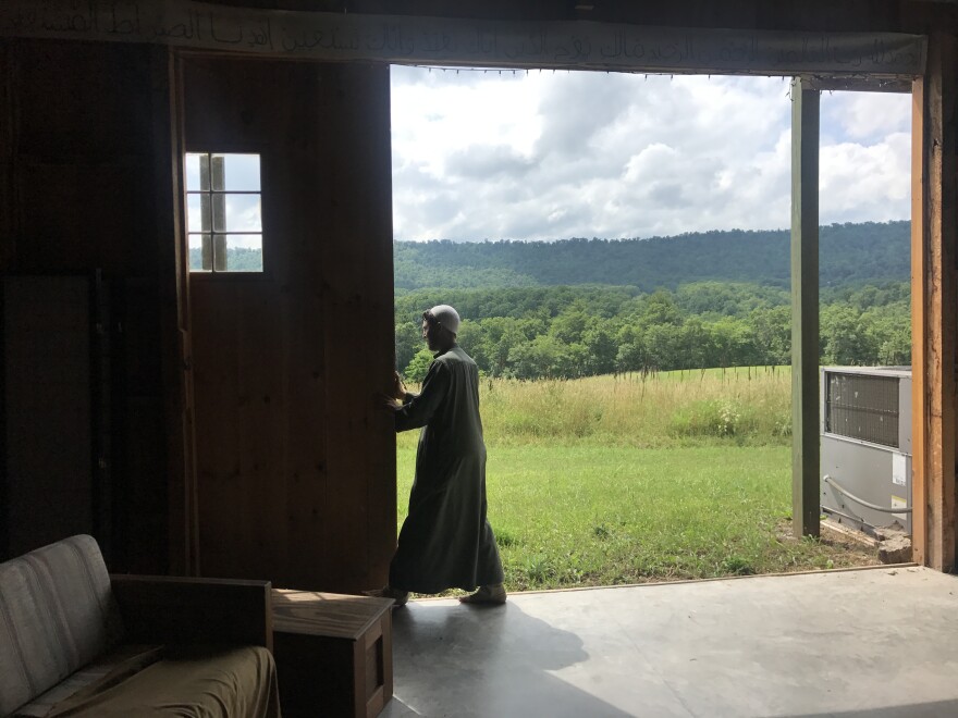 Imam Jamil Bastress opens the barn on their Sufi commune in rural Pennsylvania. They often pray here on Fridays.