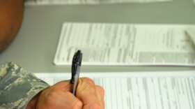 Two people registering to vote.