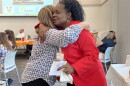 Sylvia Bennett-Stone, founder of Voices of Black Mothers United, embraces a well-wisher at UVA's third annual Gun Violence Prevention Summit.