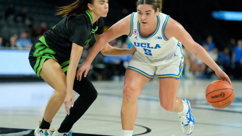 Basketball player driving toward the net