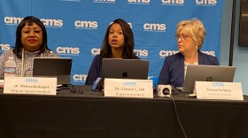 Superintendent Crystal Hill (center) addresses select reporters at an Aug. 12 briefing on her student assignment proposal.
