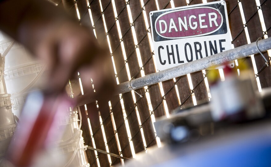 A technician checks chlorine levels in Walnut Creek Pool.