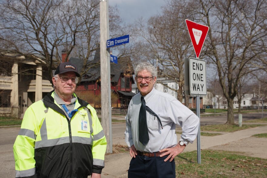 Kalamazoo Traffic Engineer Dennis Randolph and Kalamazoo resident James Voigt stand at the instersection of Elm Crossover and Elm Street