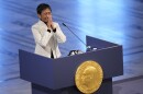 Nobel Peace Prize winner Maria Ressa of the Philippines gestures as she speaks during the Nobel Peace Prize ceremony at Oslo City Hall, Norway, Friday, Dec. 10, 2021. (AP Photo/Alexander Zemlianichenko)