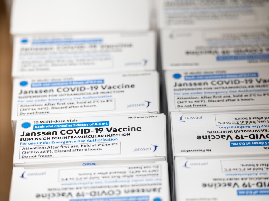 Boxes containing vials of the Janssen COVID-19 vaccine sit in a container before being transported to a refrigeration unit at Louisville Metro Health and Wellness headquarters on March 4 in Louisville, Ky. The FDA approved the third COVID-19 vaccine on Feb. 27.