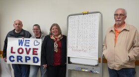 Several members of the "Save the CRPD" group pose next to a breakdown of Clearfield Borough's yearly spending on police services since 2017. From left to right is Joe Marino, Kelley Fulton, Christina Fulton and Bruce Fair. 