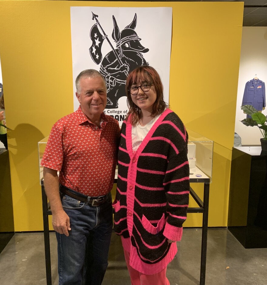 U.S Navy veteran Todd Manas and Ringling College student, Sierra Schumann smile at camera.