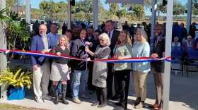 Officials, including Newberry Mayor Jordan Marlowe, University of Florida President Kent Fuchs and UF/IFAS Alachua County Extension Director Cynthia Sanders, cut the ribbon for the new UF/IFAS Alachua County Extension Office in Newberry. (Bryce Schuele/WUFT News)