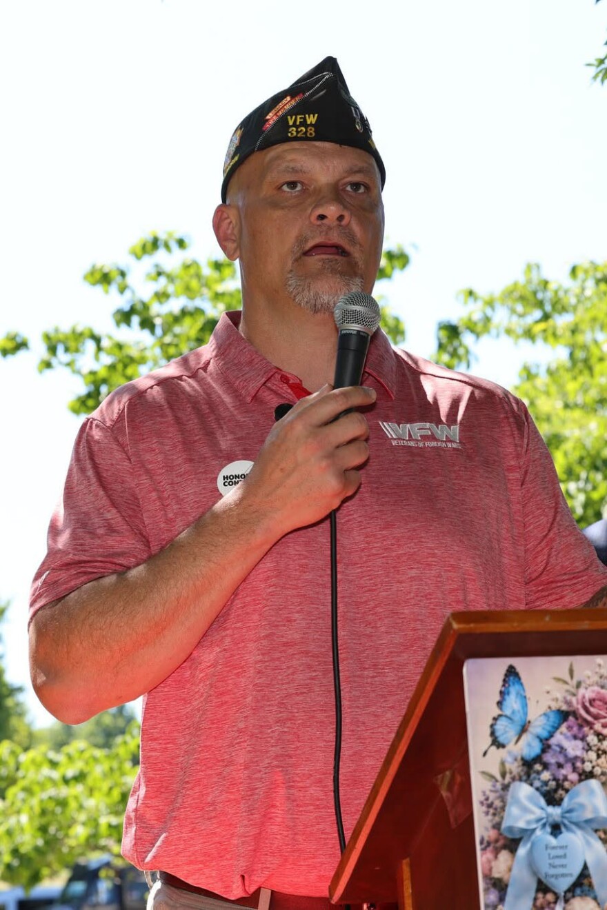 Jason Johns, the head of the National Legislative Committee for the Veterans of Foreign Wars, speaks outside the U.S. Capitol in favor of legislation to speed the Camp Lejeune water settlement process. He said one law firm is representing about 2000 plaintiffs, and nearly 10 percent have died in the past two years.