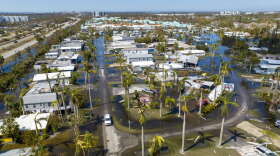 Water floods a damaged trailer park in Fort Myers on Saturday, after Hurricane Ian passed by the area. AP Photo: Steve Helber