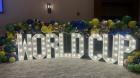 A light a balloon display reads "World Cup."