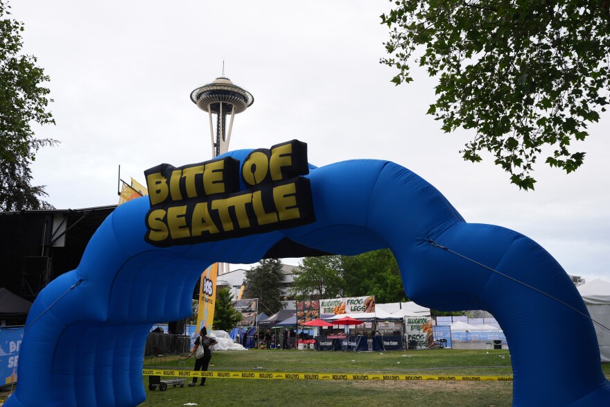 The entrance to "Bite of Seattle" is seen as police respond to a shooting at Seattle Center during the food festival Sunday, July 26, 2026, in Seattle, Wash.