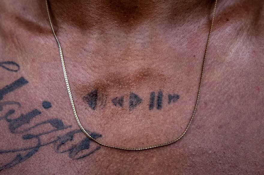 Yoandri Bacho, bboy 'Kimera', maded a play/stop tattoo in his chest to symbolize his connection with music, especially hip hop.