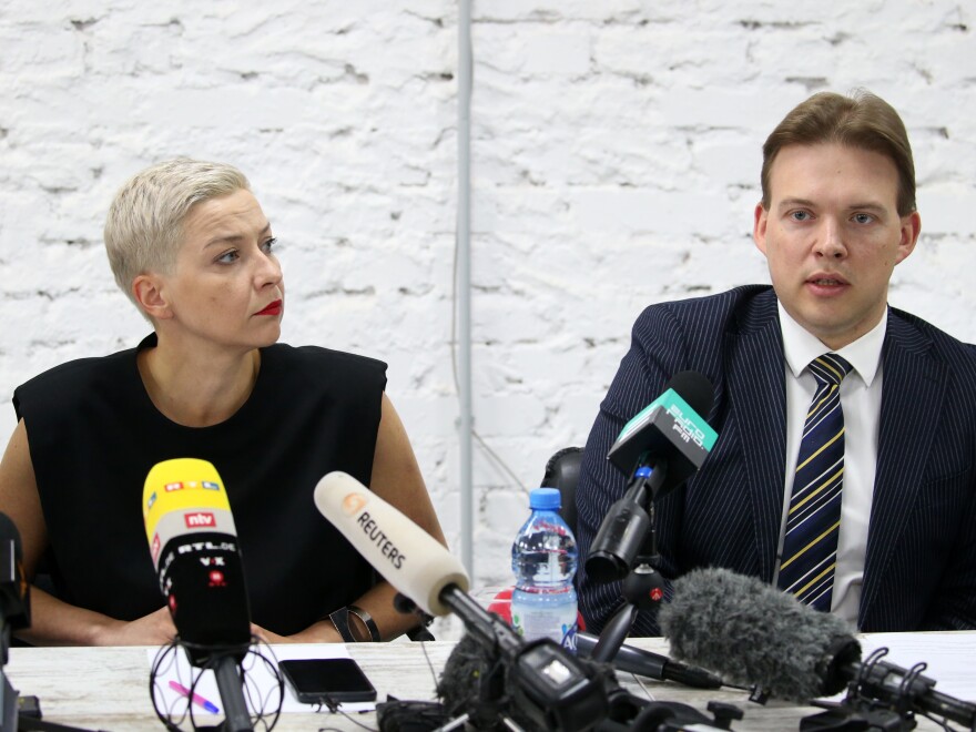 Opposition figures Maxim Znak and Maria Kolesnikova, shown here at a press conference in Minsk last month, were both detained this week. Eyewitnesses saw masked men detain Znak Wednesday morning in Minsk. The country's powerful Investigative Committee said Kolesnikova and Znak were being held because of their "calls urging action aimed at harming national security."
