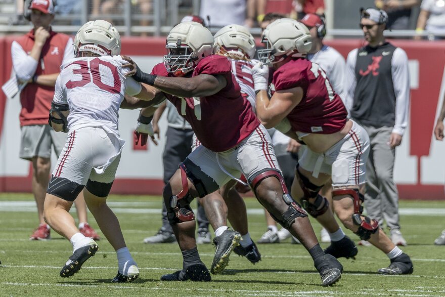 FILE - Alabama offensive lineman Jaeden Roberts (77) blocks against linebacker Cayden Jones (30) during Alabama's A-Day NCAA college football practice and autograph session, April 12, 2025, in Tuscaloosa, Ala. (AP Photo/Vasha Hunt, file)
