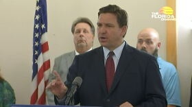 Ron DeSantis speaking at the podium